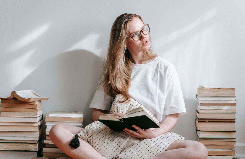 Best Books on Networking to Help You Network In Real Life 1 Women reading one of the best books on networking