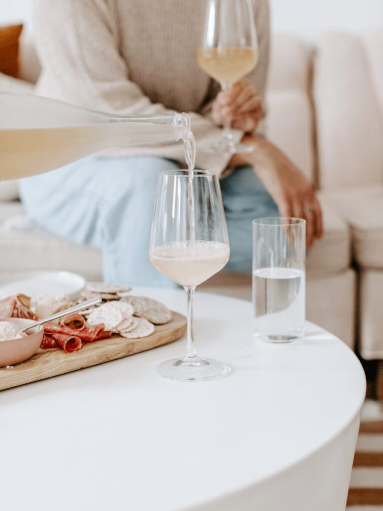 Work anniversary gifts for her include champagne